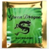 Burning Green Dragon Herbal Incense stick in ceramic holder